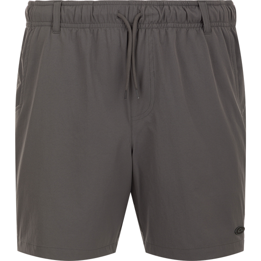 Dock Short 6" - A grey swim trunk shorts with a string, made from durable 90% Nylon/10% Spandex fabric. Features quick-drying, water-resistant Nano-Tex DWR finish. Elastic waist with 5 belt loops and external drawstring for a perfect fit. Includes front slash mesh pockets, back YKK zippered mesh pockets, and a bonus pliers' pocket. Perfect for boat to dock transitions.