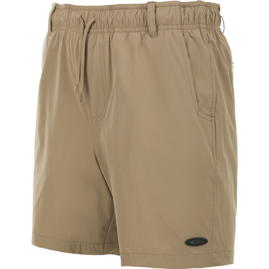 Dock Short 6" - tan swim trunk shorts made of durable 90% Nylon/10% Spandex fabric. Features include quick-drying, water-resistant Nano-Tex DWR finish, elastic waist with 5 belt loops, and an external drawstring. Includes front and back mesh-lined pockets, plus a bonus pliers pocket. Perfect for boat to dock transitions.