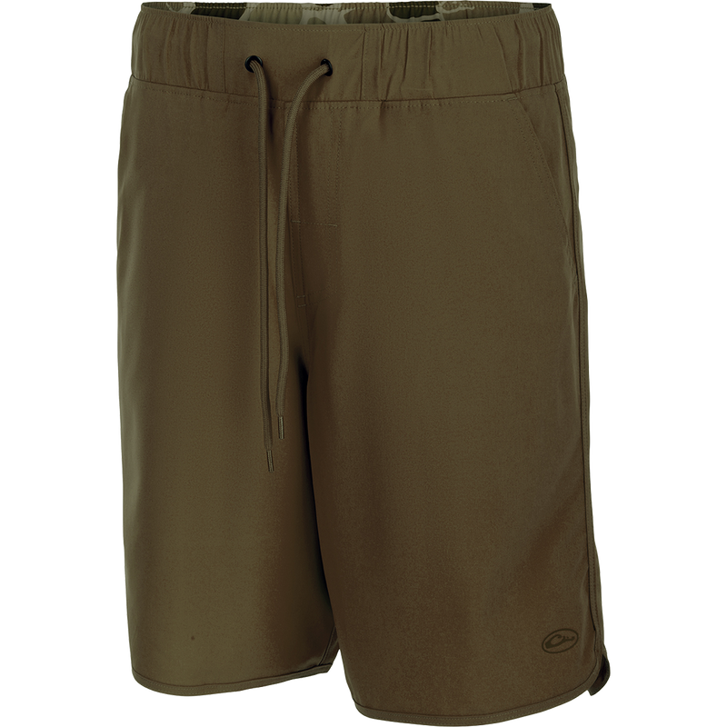 A pair of Commando Lined Volley Shorts with drawstring, scalloped hem, and hidden zipper pockets. Versatile and quick-drying, perfect for beach to bar.