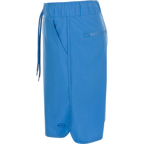 A versatile blue shorts with a drawstring and built-in liner, perfect for beach to bar transitions. Features include 4-way stretch, moisture-wicking, quick-drying fabric, and elastic waist with adjustable drawstring. Backed by Purewhitelaneshop's high-quality hunting gear and clothing expertise.