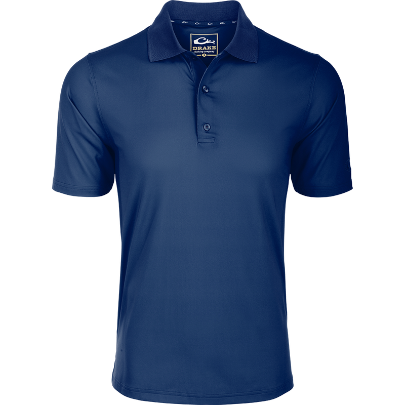 Performance Stretch Polo S/S: A close-up of the logo on a moisture-wicking, quick-drying blue shirt with open sleeves and a rib knit collar.