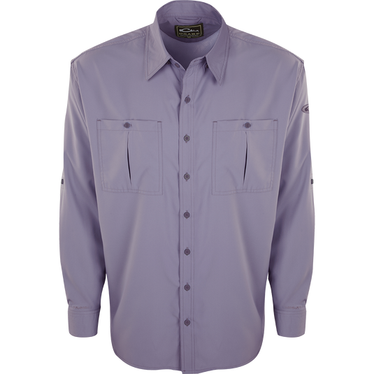 A close-up of the Flyweight Shirt with Vented Back L/S. A long-sleeved purple shirt featuring a logo and pocket. Lightweight, breathable, and quick-drying. Perfect for warm-weather outdoor activities.