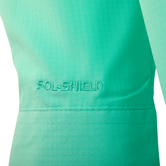 A close-up of the Flyweight Shirt with Vented Back L/S. Ultra-lightweight and breathable, designed for warm-weather outdoor activities. Quick-drying, moisture-wicking, and UPF 50+ sun protection. Vented mesh back and horizontal chest pockets.