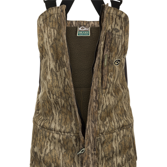 MST Ultimate Wader Bib: A vest with a logo and multiple pockets for storage. Made of polyester fleece with a Sherpa fleece lining.
