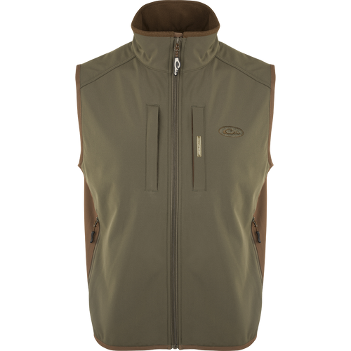 EST Windproof Tech Vest, featuring a logo and zipper details. This khaki vest is made of high-quality polyester tech shell and bonded fleece lining with a windproof membrane. It's perfect for outdoor activities and can be worn as a core or outer layer. Stay warm and stylish with this versatile vest from Purewhitelaneshop.