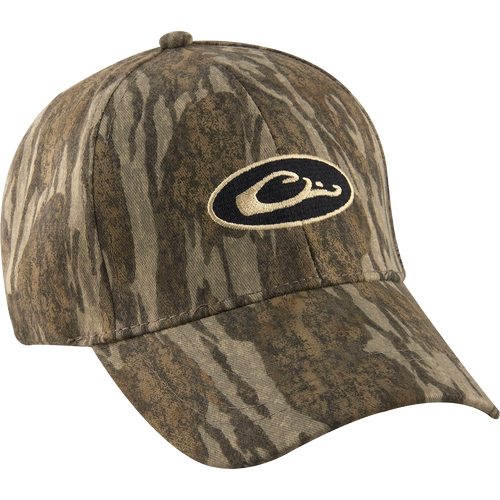 Camo Cotton Cap with logo, perfect for outdoor enthusiasts. Lightweight and comfortable, it features camo concealment under the bill to reduce glare. Six-panel construction and hook and loop closure for a secure fit. Made with 100% cotton. From Purewhitelaneshop, your go-to store for high-quality hunting gear and clothing.
