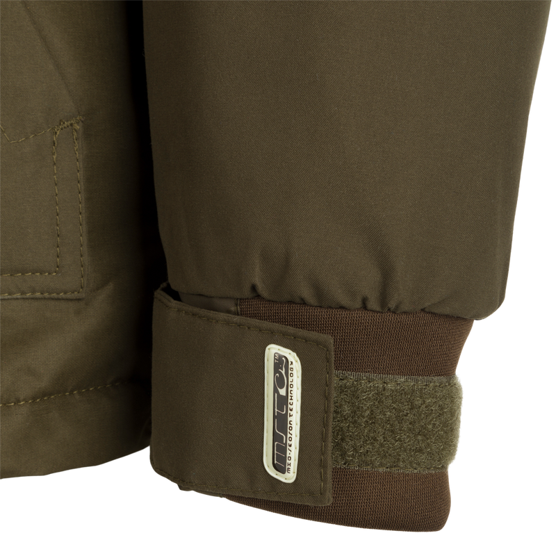 MST Waterproof Fleece-Lined 1/4 Zip Jacket: A close-up of a khaki jacket with adjustable cuffs, multiple pockets, and a rear storage pouch.