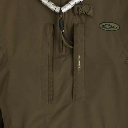 MST Waterproof Fleece-Lined 1/4 Zip Jacket: A close-up of a khaki jacket with logo, adjustable cuffs, and multiple pockets for secure storage and comfort.