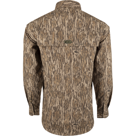 A lightweight, long-sleeved shirt with a tree pattern. Designed for breathability during hunts or at the shooting range. Features vents, mesh, and button tabs on sleeves. From Purewhitelaneshop.