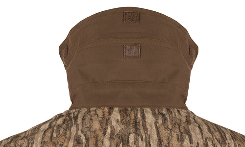 A close-up of the EST Camo Wingshooter's Shirt L/S, showcasing its breathable mesh, vents, and functional design for hunting and shooting activities.