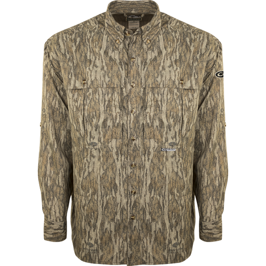 A lightweight, breathable EST Camo Flyweight Wingshooter's Shirt with a camouflage pattern. Made of 100% polyester for quick drying and moisture-wicking. Features include UPF 50+ sun protection, vented mesh back, and multiple chest pockets. Perfect for early season hunting.
