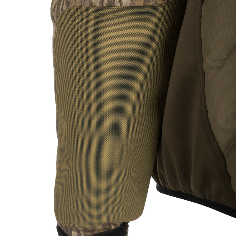 A close-up of the LST Guardian Flex Double Down Eqwader Full Zip jacket, featuring a waterproof and windproof upper body, synthetic double down insulation, and stretch breathable fabric on the lower sides. Stay warm and dry in any outdoor conditions with this durable and comfortable hunting gear.