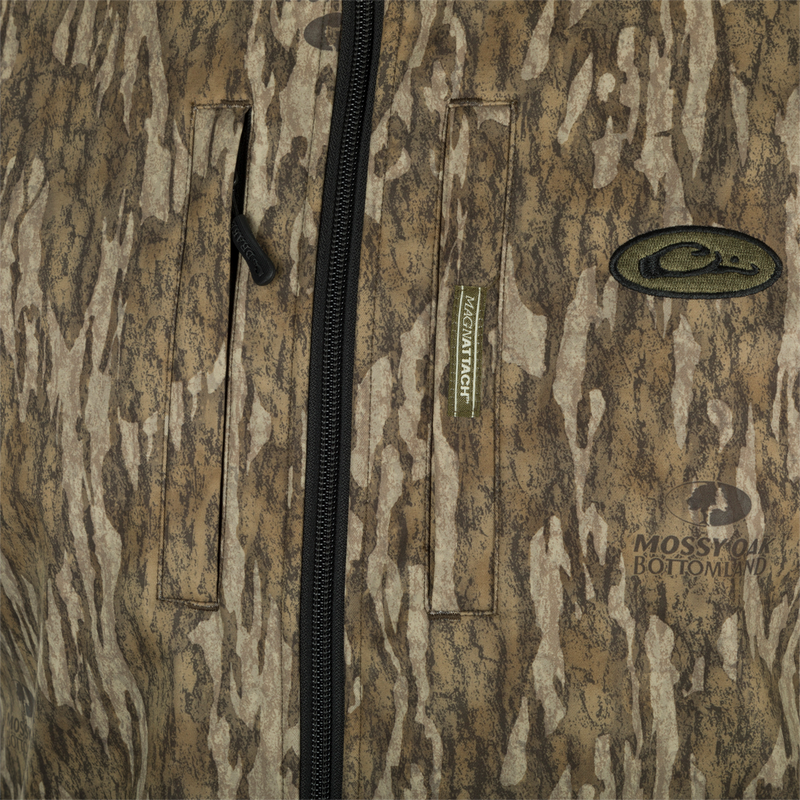 A close-up of the MST Windproof Softshell Vest, showcasing its expert-level functionality. Features include multiple pockets for secure storage, adjustable drawcord waist, and a comfortable grid-fleece collar lining. Made with high-quality materials for superior comfort and breathability.