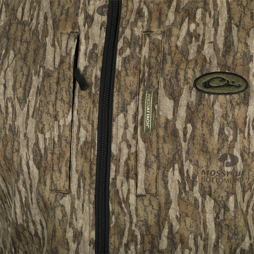 A close-up of the MST Windproof Softshell Vest, showcasing its expert-level functionality. Features include multiple pockets for secure storage, adjustable drawcord waist, and a comfortable grid-fleece collar lining. Made with high-quality materials for superior comfort and breathability.