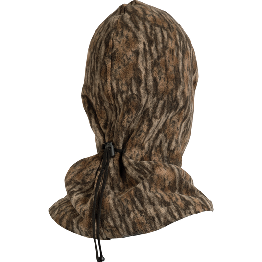 MST Face Mask: A midweight fleece mask with a hood, black strap, and zipper. Tailored eye and mouth openings for breathability and visibility. Adjustable back cinch for a secure fit. Ideal for cooler temperatures and outdoor activities.
