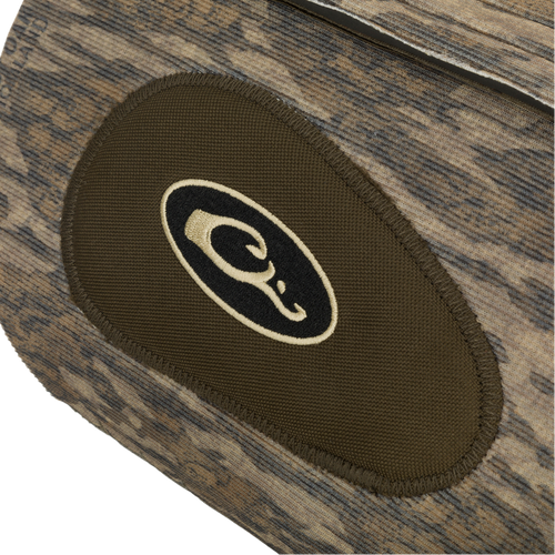 Close-up of the Drake Neoprene Dog Vest, showcasing the reinforced protection areas and a black and white logo for added durability and comfort.