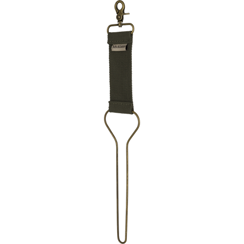 A close-up of the McAlister Game Bird Totes key chain, featuring solid metal hardware and a brass clip.