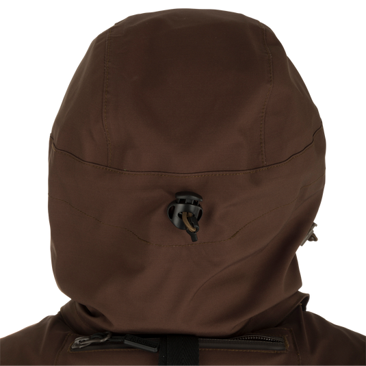 McAlister G3 Flex 3-in-1 Waterfowler's Jacket: Versatile brown jacket with black object, perfect for hunting in various weather conditions.