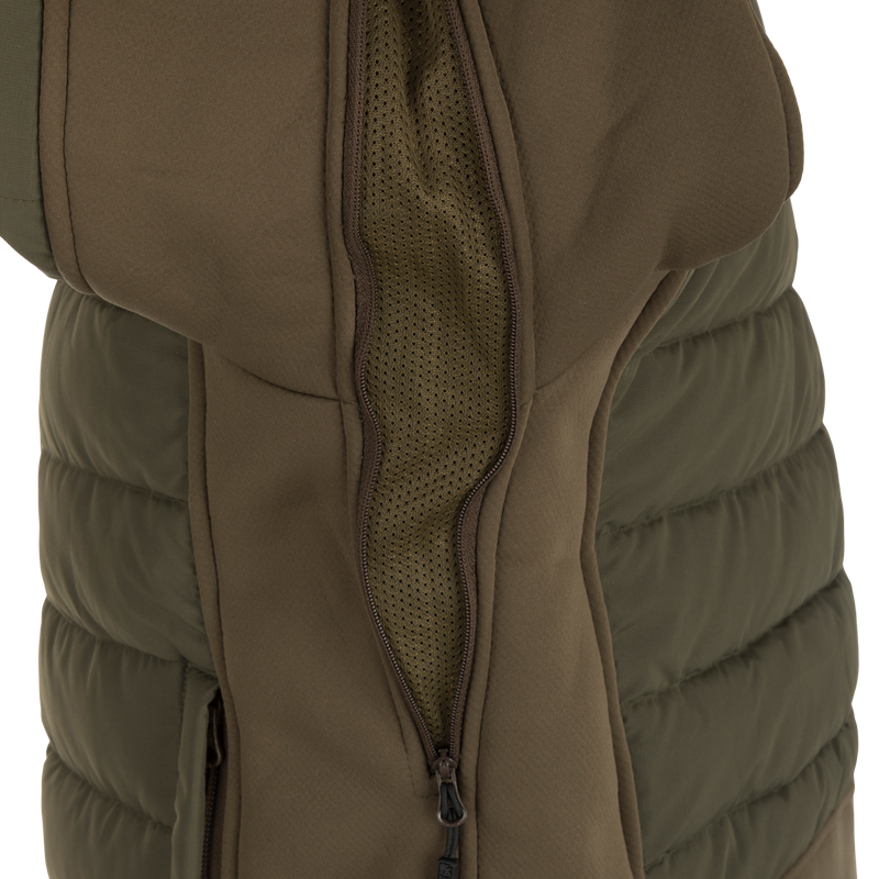 McAlister G3 Flex 3-in-1 Waterfowler's Jacket - A versatile jacket for hunting in various weather conditions, featuring a close-up of a khaki jacket with a zipper and durable fabric.