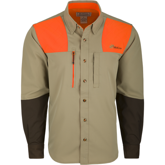 McAlister MST Upland Tech Shirt: A long-sleeved shirt with orange and black stripes, featuring a collar, button, and abrasion-resistant forearm. Includes chest pockets and an integrated lens cloth. Made of nylon, Spandex, and polyester. Ideal for hunting and outdoor activities.