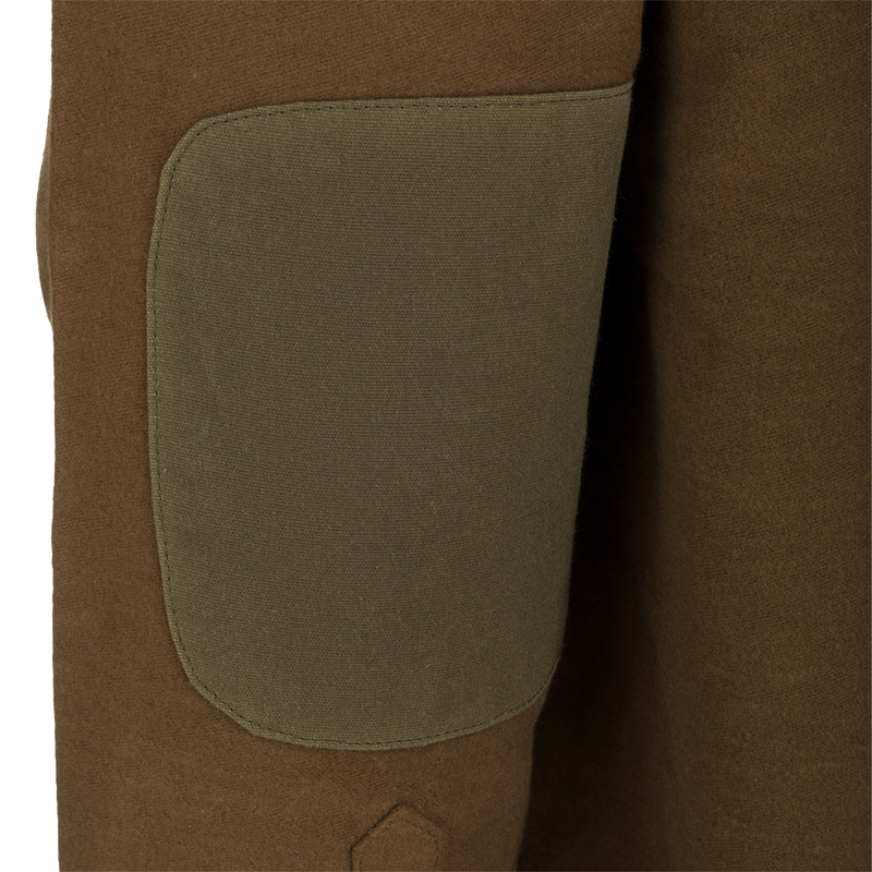 A close-up of the McAlister Windproof Moleskin Jac-Shirt, showcasing its brown fabric and Dry Waxed 100% Canvas Elbow Patches.