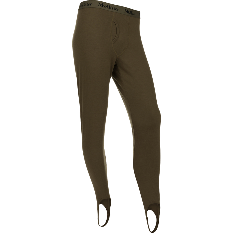 McAlister Merino Base Layer Pant: A pair of holey trousers with elastic waistband and foot stirrups for comfort and secure fit.