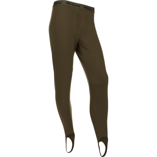 McAlister Merino Base Layer Pant: A pair of holey trousers with elastic waistband and foot stirrups for comfort and secure fit.