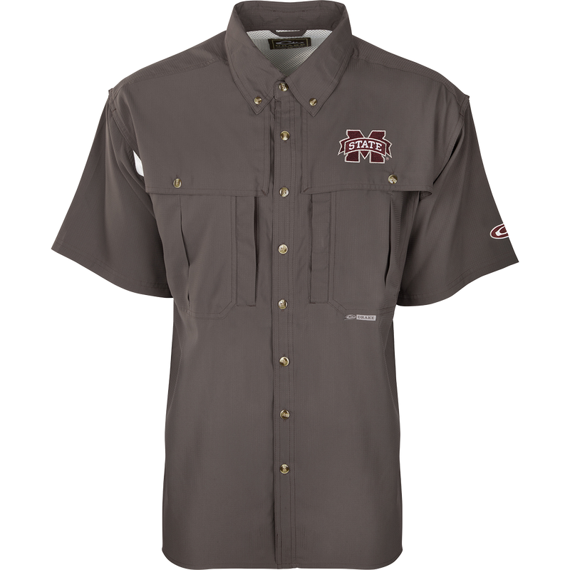 A close-up of the Mississippi State S/S Flyweight Wingshooter shirt with a logo on it, featuring a vented back design, quick-drying fabric, and multiple pockets for outdoor activities.