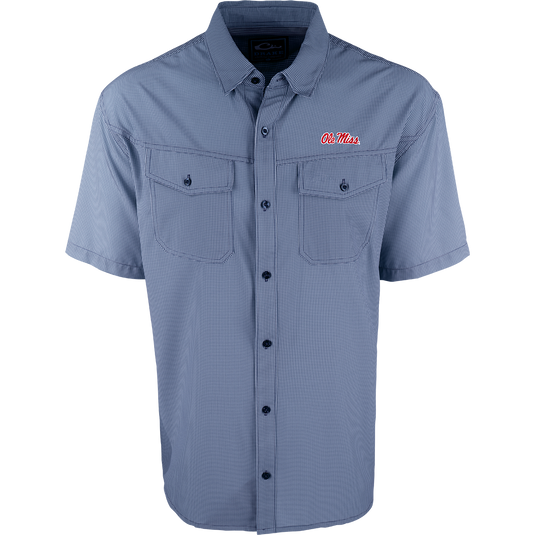 A blue and white striped shirt with four-way stretch for freedom of movement and ultimate comfort. Lightweight and wrinkle resistant, perfect for early season football games or weekend tailgates. Features moisture-wicking fabric and two chest pockets with button flaps. Ole Miss logo embroidered on the left chest.