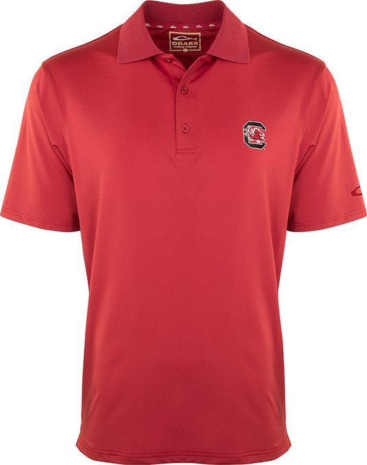 A red South Carolina Performance Stretch Polo with the official Alabama logo on the left chest. This ultra-lightweight, moisture-wicking polo is perfect for the big game or a round of golf. Made of 92% polyester and 8% spandex, it offers four-way stretch, quick-drying, and breathability. Final Sale item from Purewhitelaneshop.