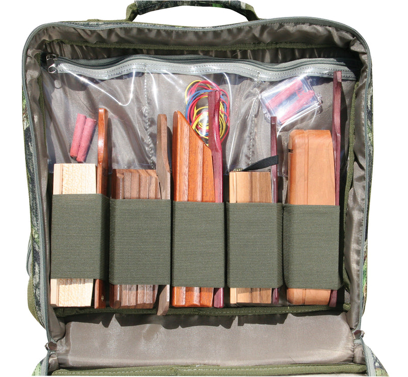 Ol' Tom Treasure Chest, a bag with wood pieces, red and yellow cable, plastic container, hotdog, white object, piece of wood, brown leather case, and grey fabric.