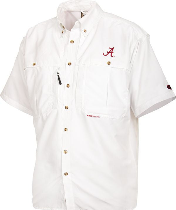 A white button-up shirt with a logo, perfect for Game Day. Breathable, cool, and quick-drying. Features include front and back ventilation, oversized chest pockets, and a Magnattach™ pocket. Alabama Wingshooter's Shirt S/S.